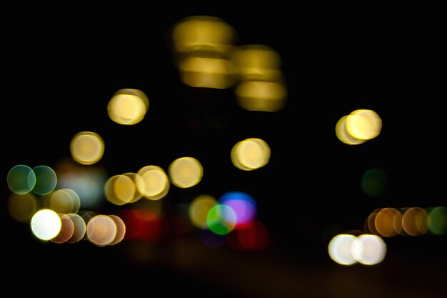 Bokeh car headlights at night on street Blurred image of light of street lamps and car headlights