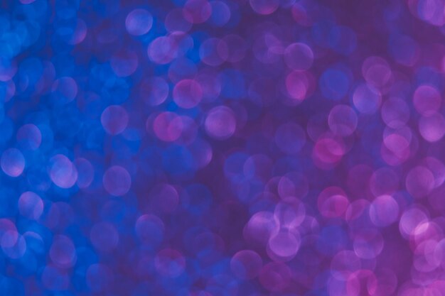 Bokeh color gradient blur light overlay ultraviolet\
illumination defocused neon blue purple pink glow round bubbles on\
fluorescent abstract background