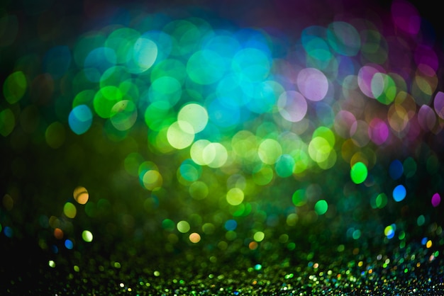 Bokeh effect glitter colorful blurred abstract background for birthday, anniversary, wedding, new year eve or Christmas.