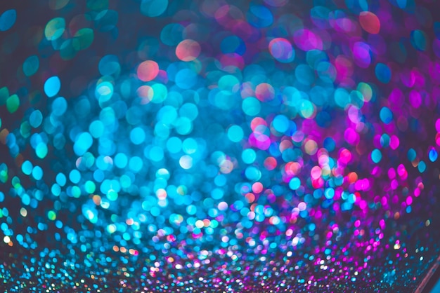 Bokeh effect glitter colorful blurred abstract background for birthday anniversary wedding new year eve or Christmas