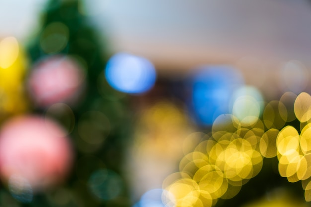 Bokeh from blurred gold lights in Christmas celebrate party, X'mas concept.