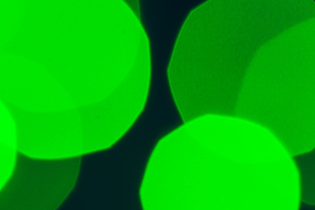 Bokeh of green garland lighting elements 