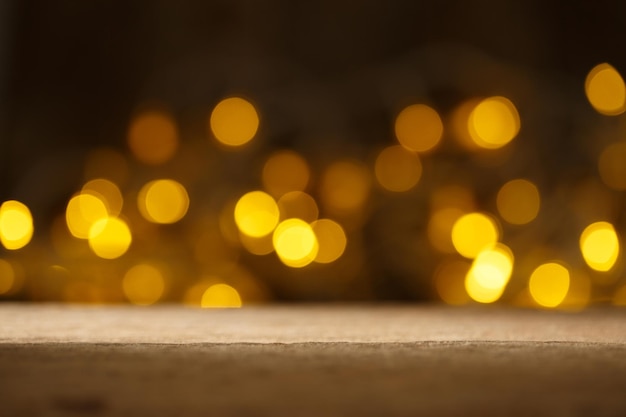 Bokeh lighting backdrop with wood table