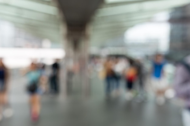 Bokeh of people crossing pedestrian bridge