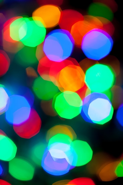 Bokeh texture of multicolored christmas and new year lights