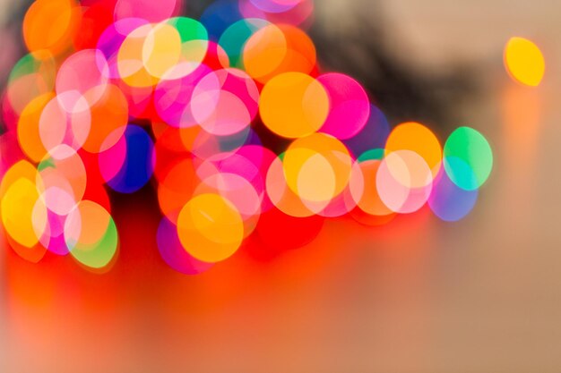 Boken background of colorful Christmas lights.