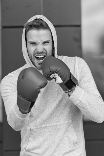 Foto boksconcept energieke sportman in bokshandschoenen man bokser klaar om te boksen er gaat niets boven boksen