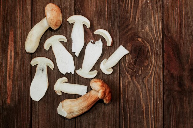 Boletus edulis on a table made of brown boards preparation for eating