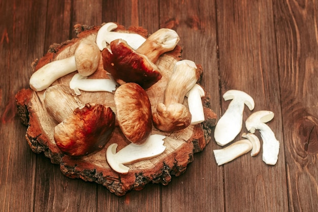 Boletus edulis on a table made of brown boards preparation for eating