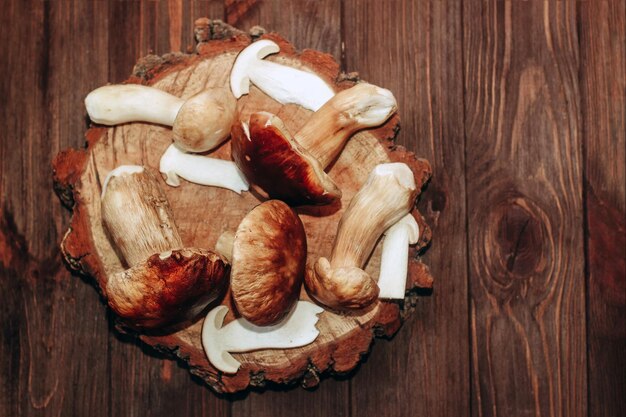 Boletus edulis on a table made of brown boards preparation for eating