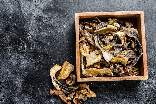 Boletus wild dried mushrooms in a wooden box