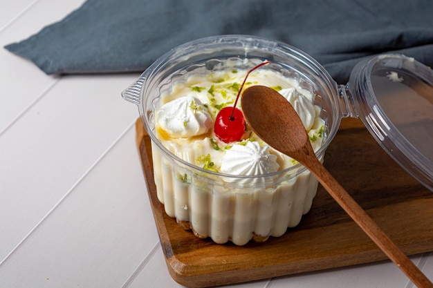 bolo de pote, traditional brazilian sweet dessert, inside a plastic container.