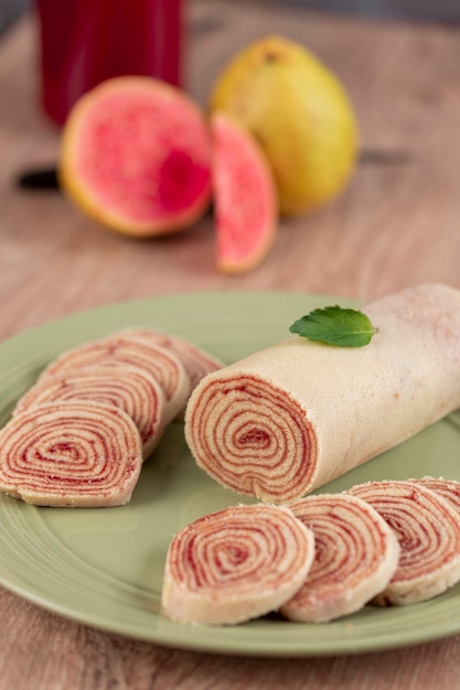 Bolo de rolo (swiss roll, roll cake) typical Brazilian dessert, from the state of Pernambuco. Sliced cake roll filled with Guava paste.