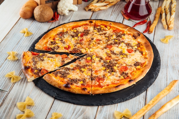 Bolognese pizza with ground beef corn and tomatoes