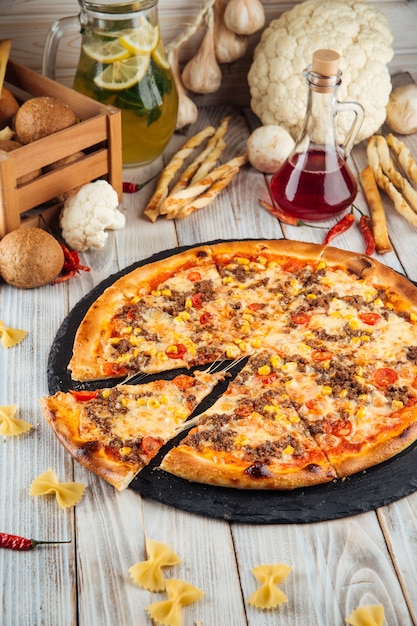 Bolognese pizza with ground beef corn and tomatoes