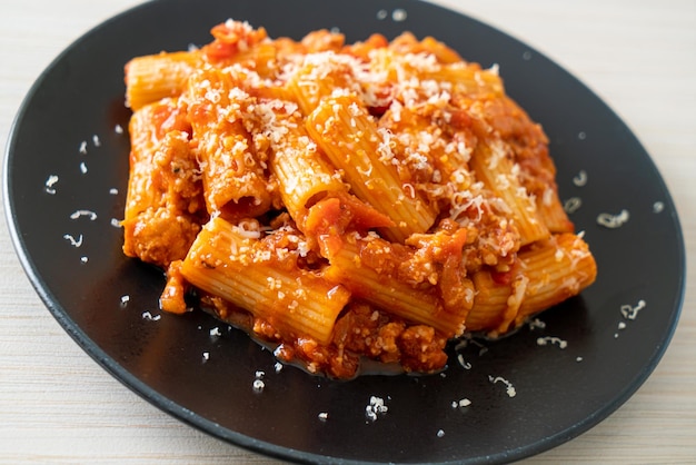 Bolognese rigatoni pasta with cheese traditional Italian pasta