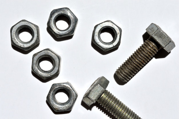 Bolts and nuts of different sizes lie. top view.