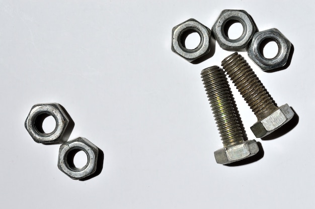 Bolts and nuts of different sizes lie. top view.