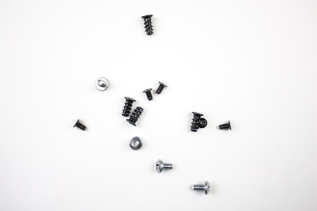 Bolts and screwsmetal screws bolts for tightening on a white\
background