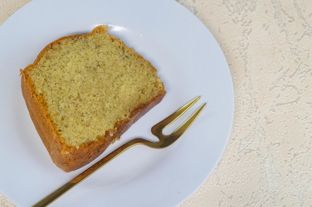 Bolu pisang or banana cake served on a white plate