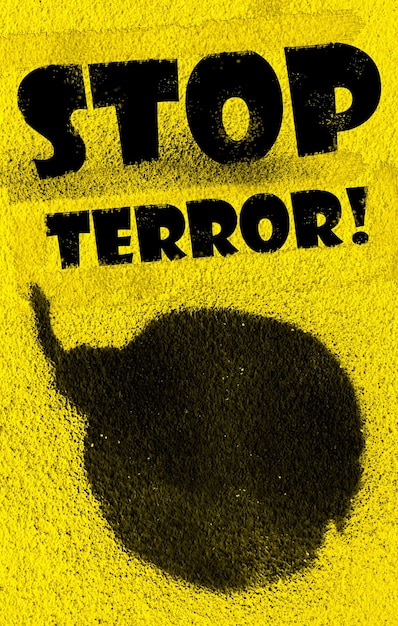 Photo bomb painted with black paint spray on yellow background message stop terror added with grunge font