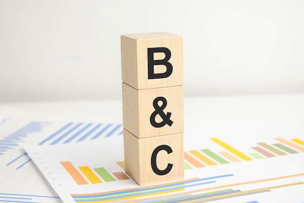 Bonds and Coupons concept abbreviation on wooden blocks and charts