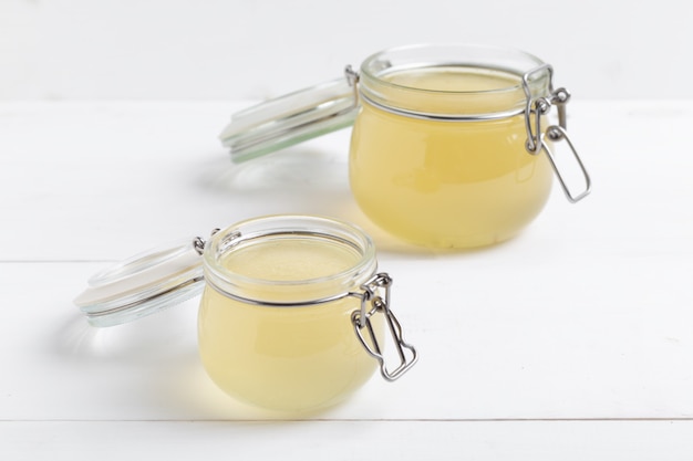 Photo bone broth made from chicken, beef or lamb in a glass jar