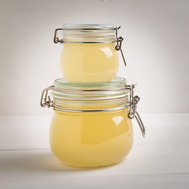 Photo bone broth made from chicken, beef or lamb in a glass jar