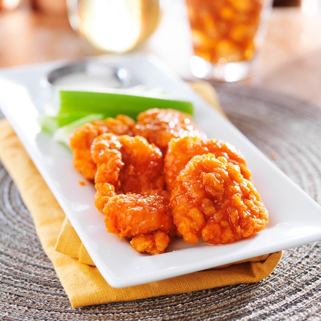 Boneless buffalo chicken wings on a plate