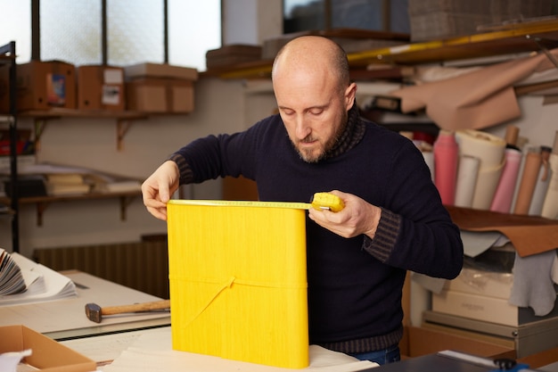 Book binder working in a warehouse