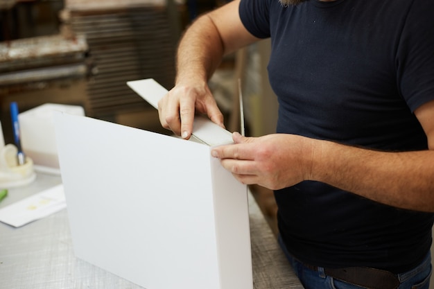 Book binder working in a workshop