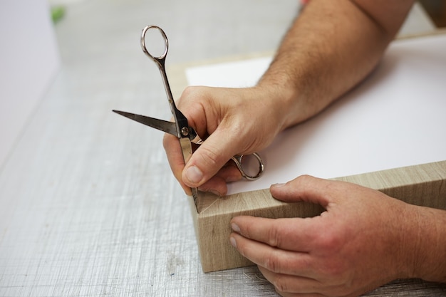 Book binder working in a workshop