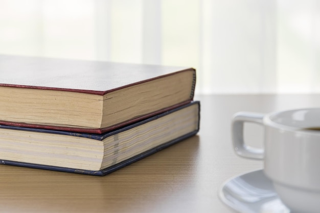 Photo book and coffee cup on a wood table