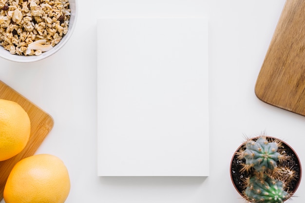 Book cover mockup with oranges and cactus