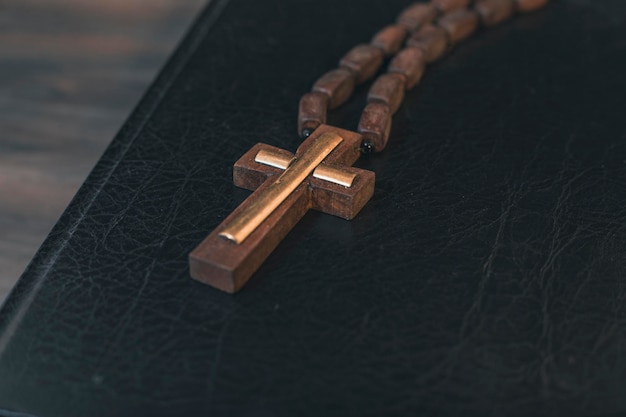 Book and cross on the table