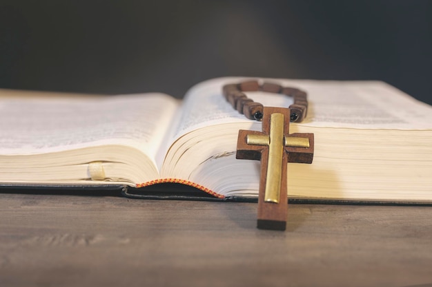 Book and cross on the table