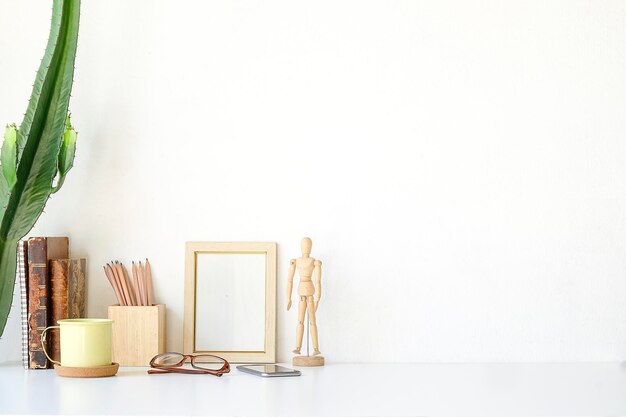 Photo book and decorations against white background