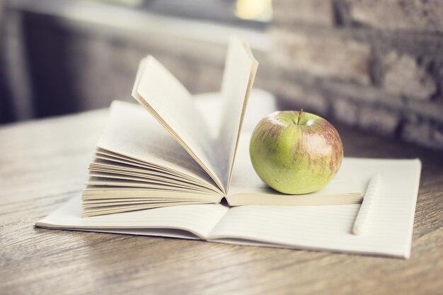 Book diary and apple