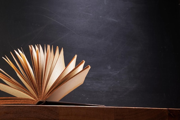 Book Fanned Isolated on blackboard