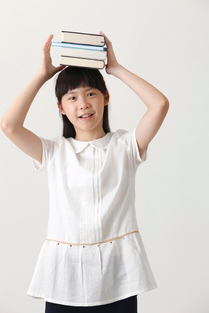 Photo book on her head