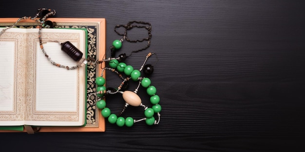 A book with a green bead and a book with a white cover and a green bead on it.