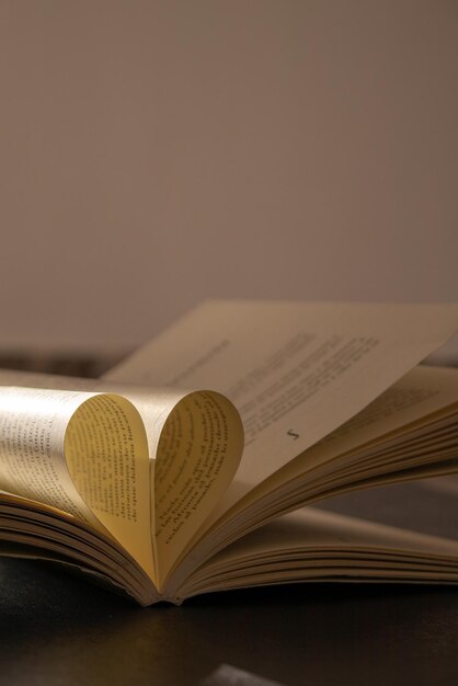 Book with heart in the middle illuminated with natural light