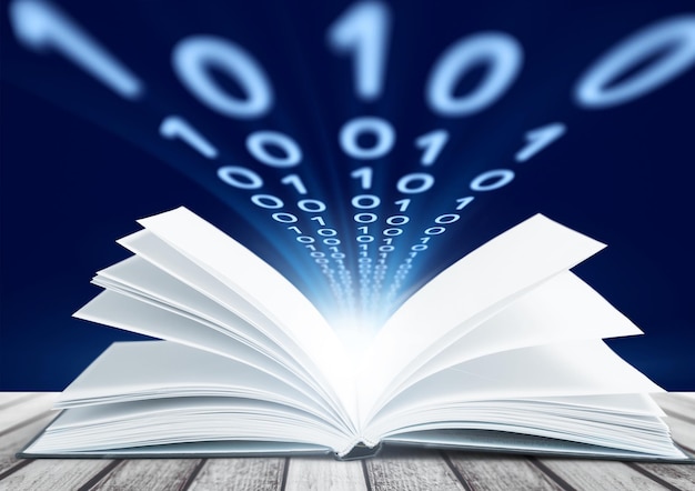 Book on wooden deck with glowing graph illustrations and symbols