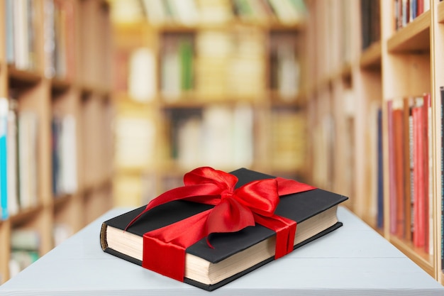 Book wrapped with a ribbon