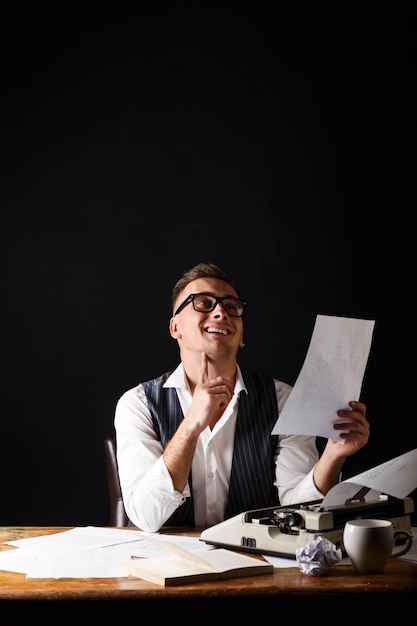 Book writer wearing white shirt sitting