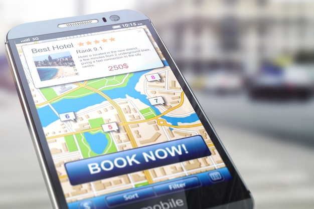 Booking hotel by smartphone Mobile phone with map of the city and proposals for appartment reservation