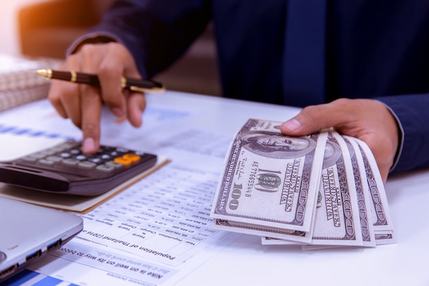 Bookkeeper or financial inspector hands making report.