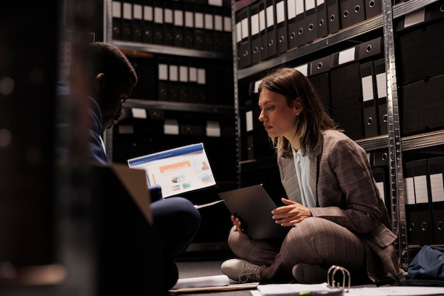 Photo bookkeepers analyzing accountancy files