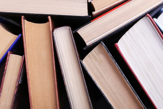 Books are randomly standing. Book background, knowledge is power.