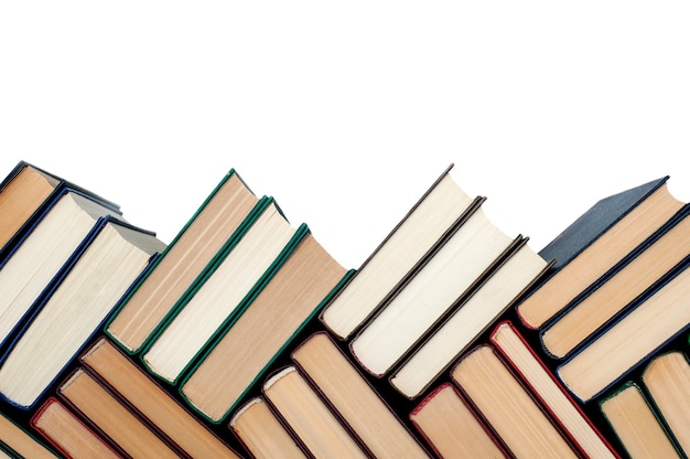 Books are stacked on a white background
